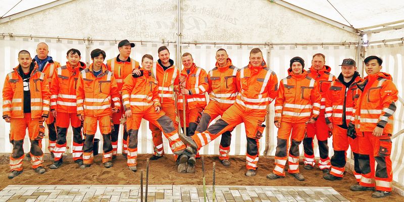 Team gewerblicher Mitarbeiter in persönlicher Schutzausrüstung (PSA).
